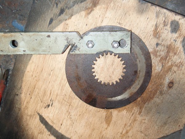 Bolt the steel strip to the old clutch plate