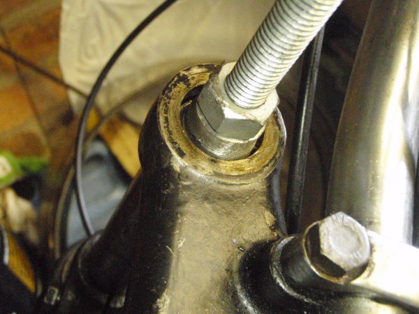 Tapped nut on a stick, in a hole.