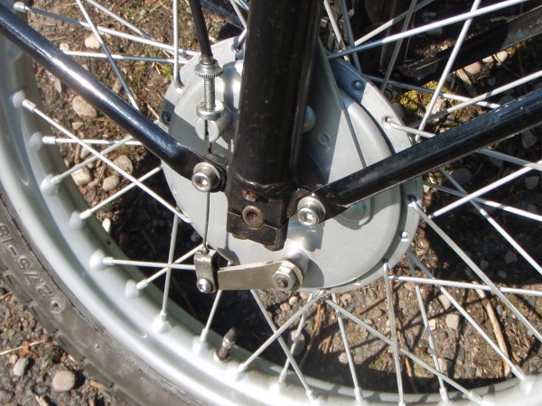 One nickel plated brake operating arm.